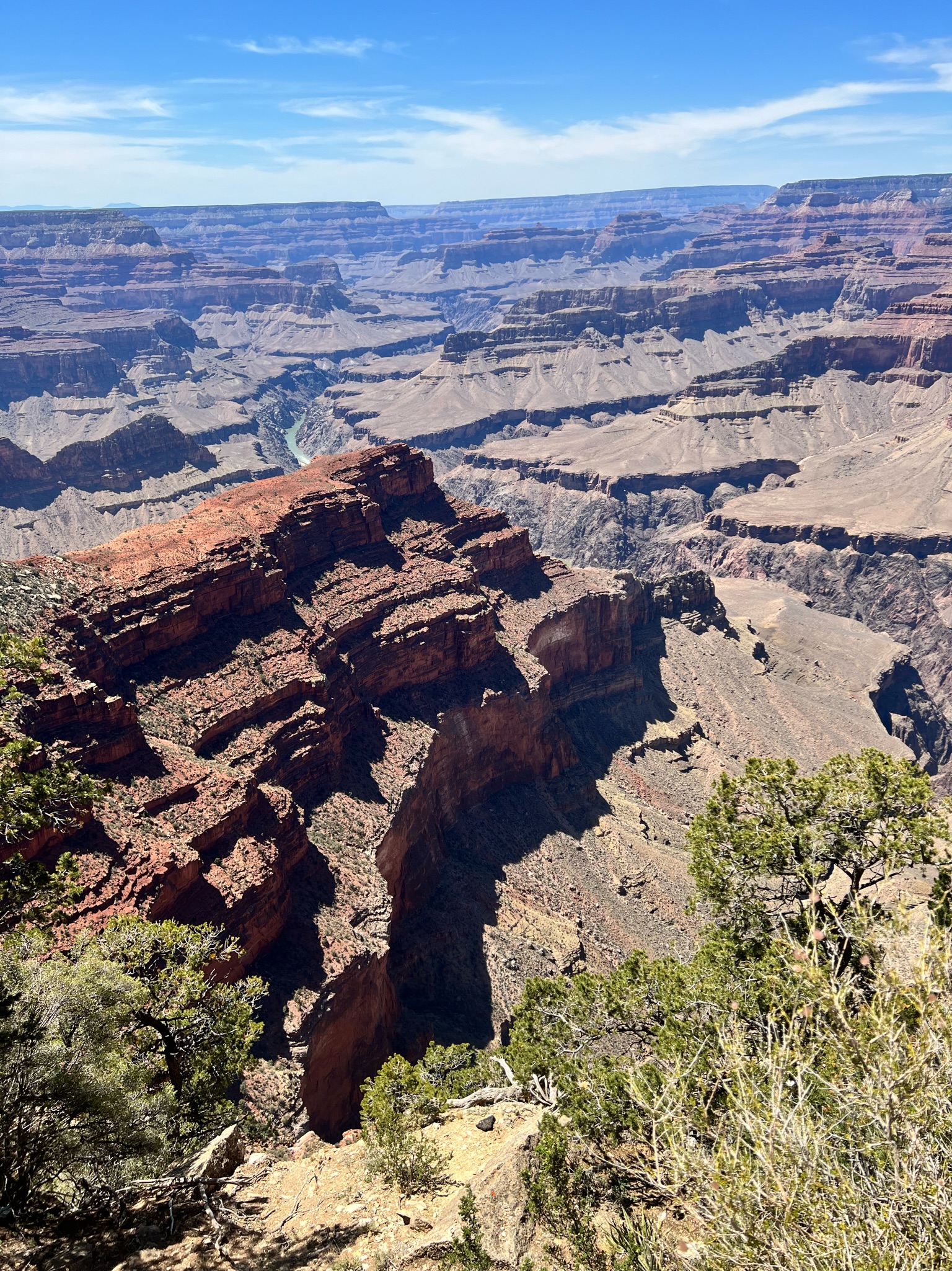 Grand canyon view with red, orange, beige and gray canyon walls.