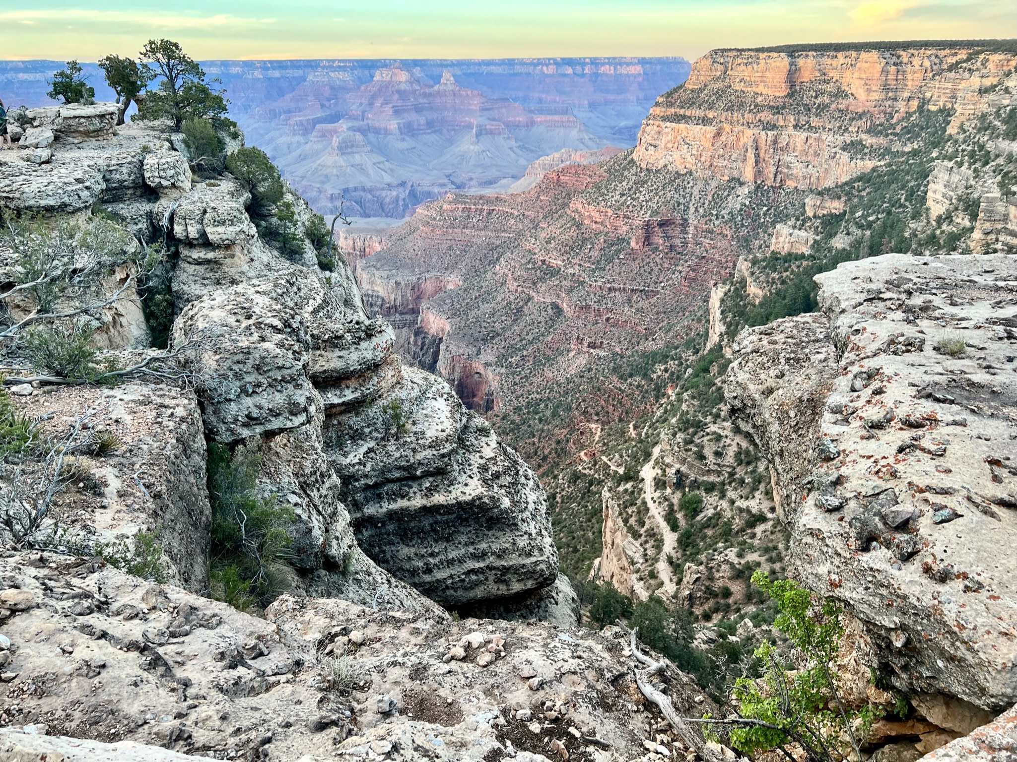 Grand canyon view with red, orange, beige and gray canyon walls.