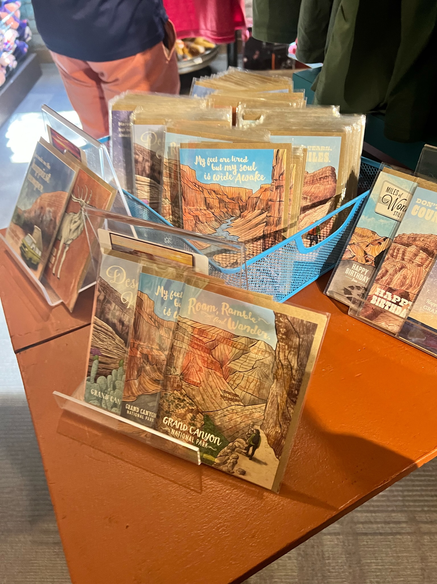 Basket and display of artistic post card souvenirs portraying the Grand Canyon