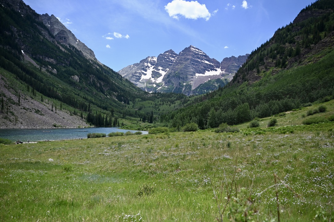 Mountains in the background with lake, and meadows in the foreground