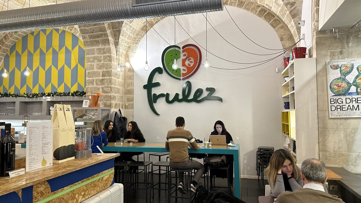 The bright counter and logo inside Frulez restaurant