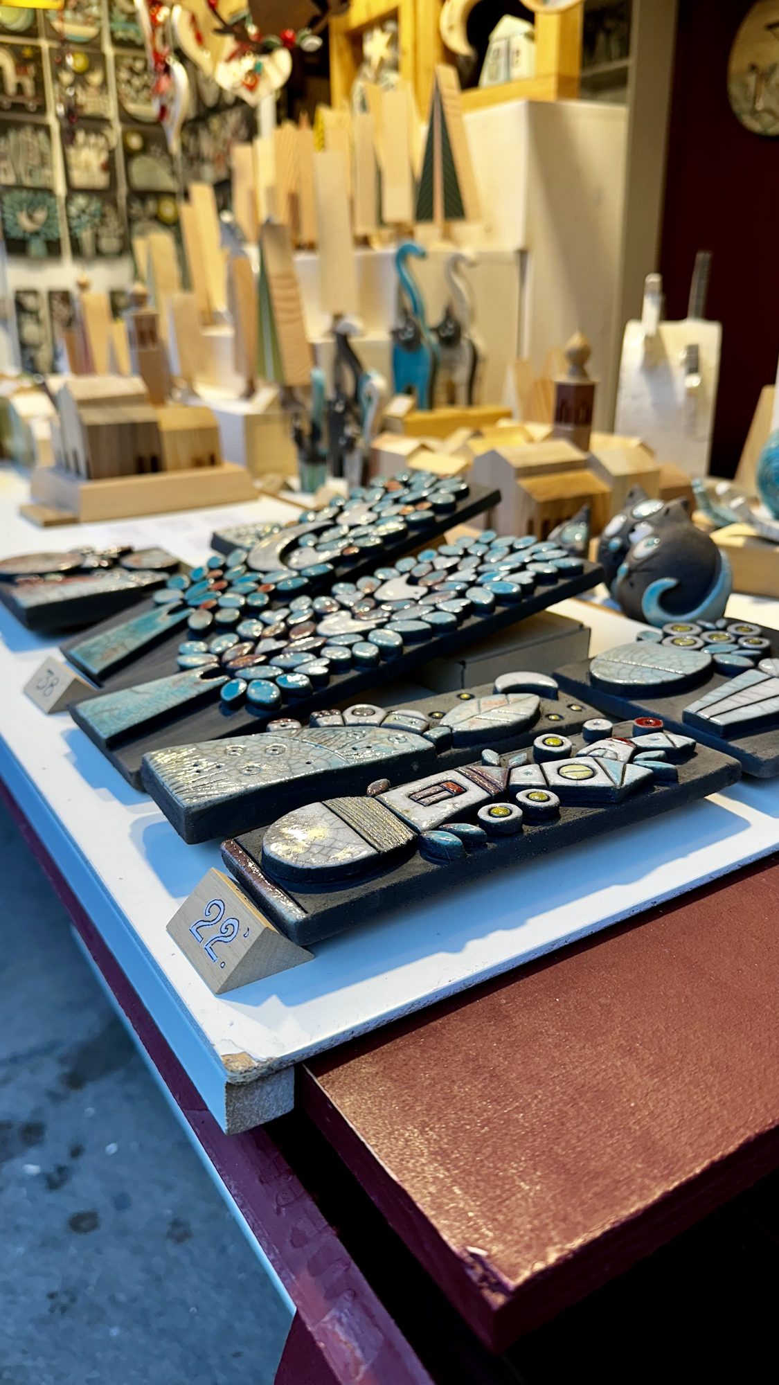 Handmade ceramic pieces on display at a Christmas market stall