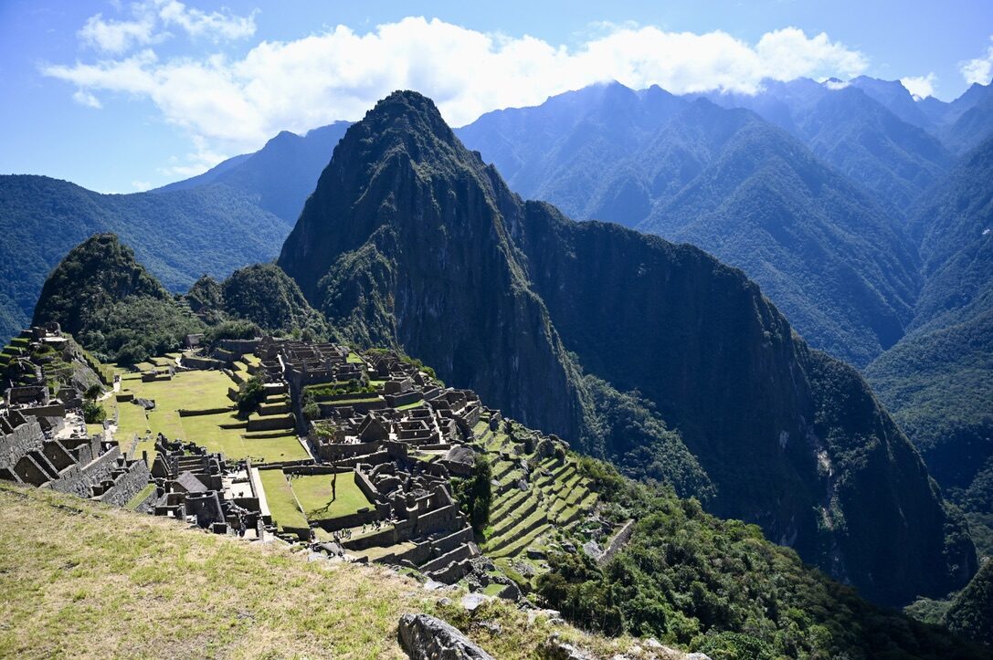 The classic view of Machu Picchu’s terraces and ruins below Huayna Picchu