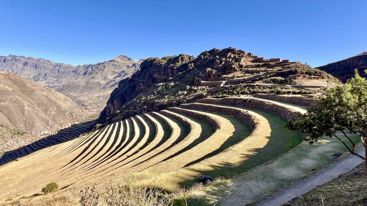 Curving agricultural terraces wrapping around the mountainside at Pisac